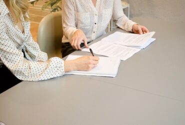 a lawyer and client looking at papers