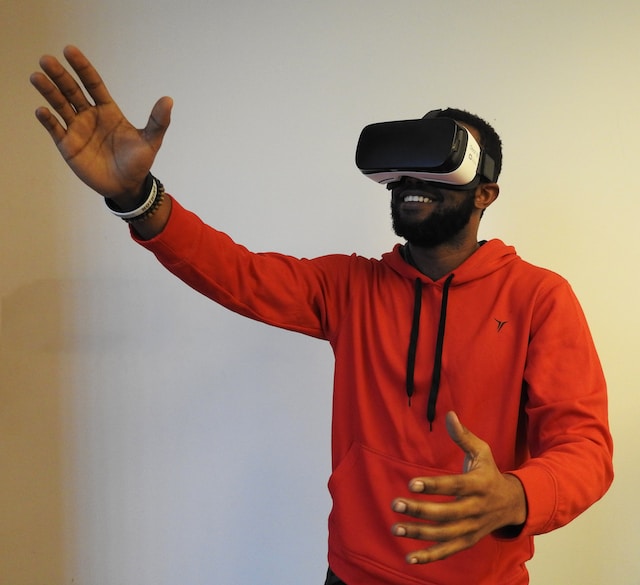 a man playing a game while wearing a VR headset