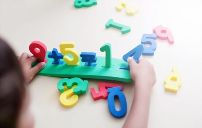 child playing with a number toy