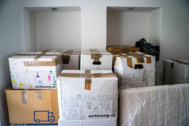 moving boxes stored in a side room