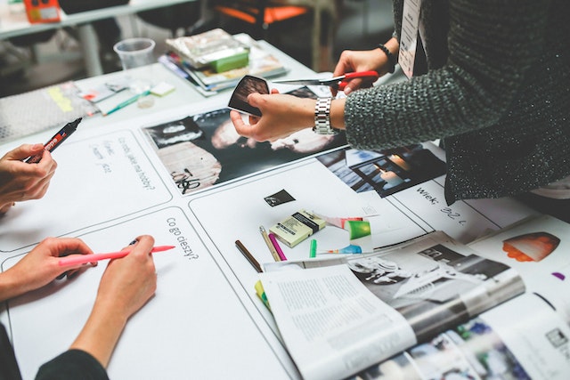 group of people working on marketing materials