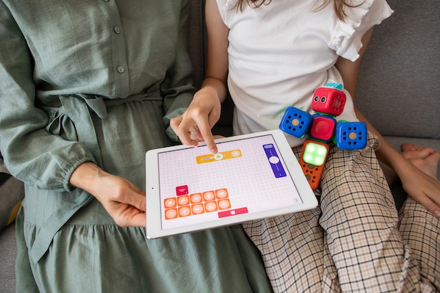 mother playing a learning game with her daughter