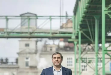 Viktor Ponomarchuk in front of manufacturing buildings