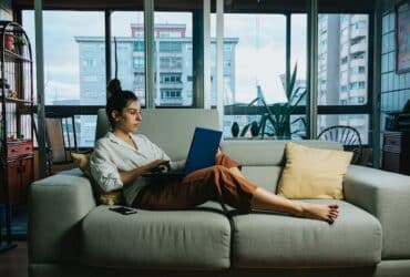 girl working on couch