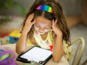 2nd grade girl playing a spelling game online on a tablet