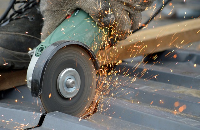 angle grinder with sparks flying on metal roofing