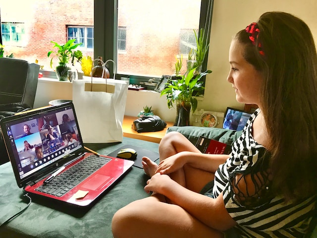 teen girl on a zoom call with her class