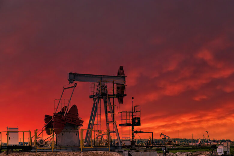 oil and gas rig at sunset