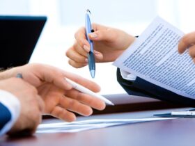 loan paperwork pen business partners