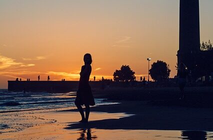 girl sunset sillohette lighthouse nature beach