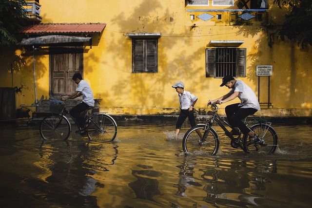 flood bikes bicycles children water flooded street