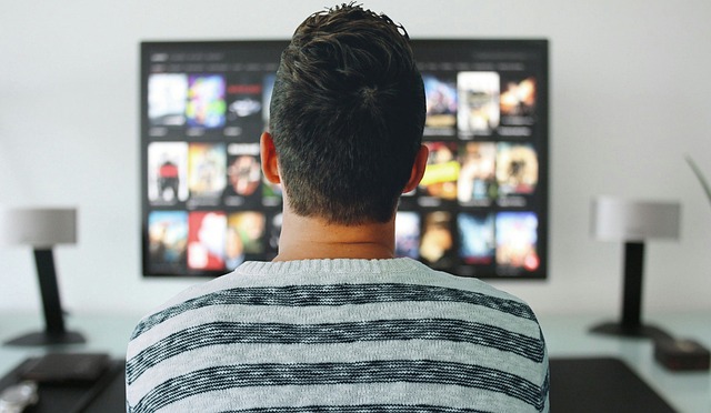man watching tv netflix streaming shows movies