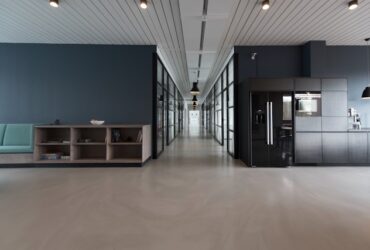 A large, open break room area in a modern office building