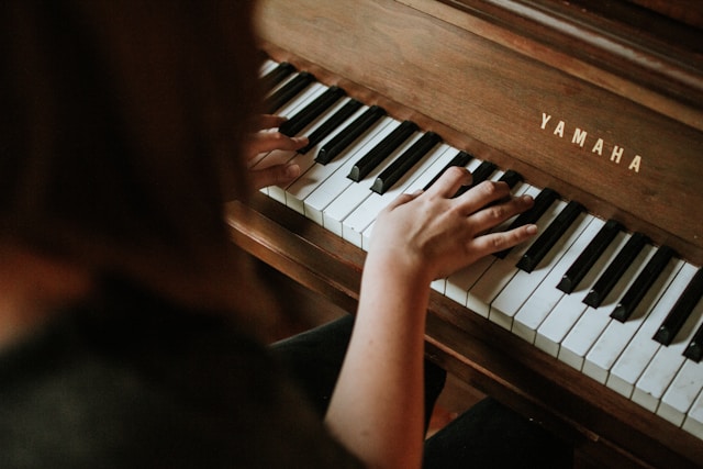 young woman practicing piano