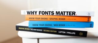 stack of books about graphic design.