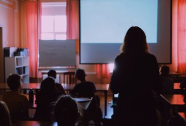 woman standing in a training seminar.