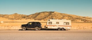 SUV pulling a camper trailer.