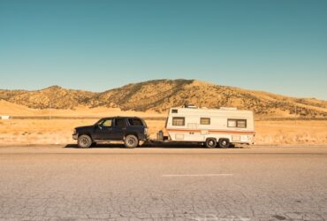 SUV pulling a camper trailer.