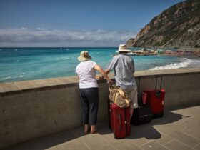 elderly couple on holiday looking out at the ocean.