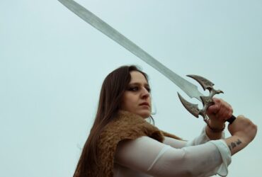 a woman wielding a sword replica.