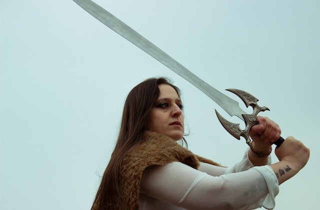 a woman wielding a sword replica.