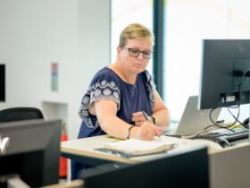 female accountant working at a computer.