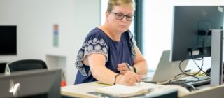 female accountant working at a computer.