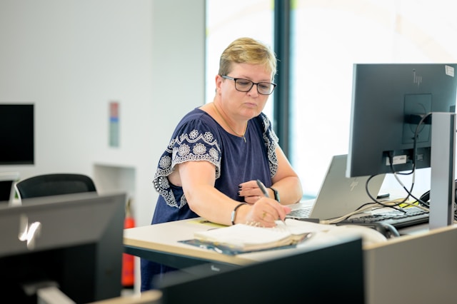 female accountant working at a computer.