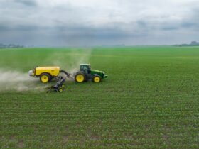 tractor pulling attachments through field.