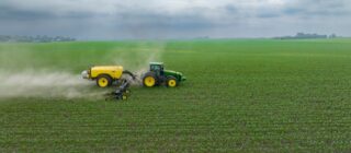 tractor pulling attachments through field.