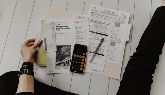 woman looking at tax return documents.