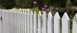 white picket fence with flowers.