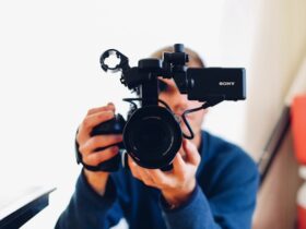 man holding a video camera.