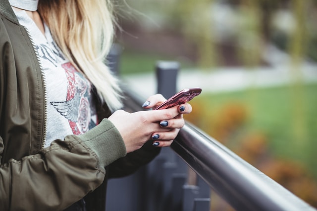 a woman looking at her phone.