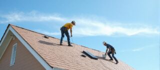 roofing crew working on a house roof.