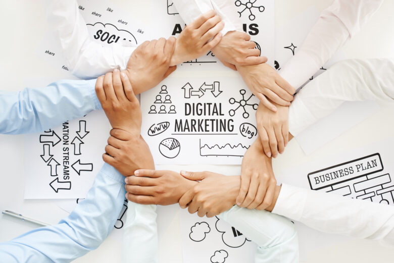 holding hands in a circle around digital marketing background