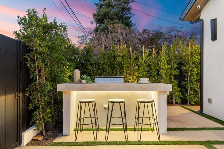 outdoor bar with chairs at sunset