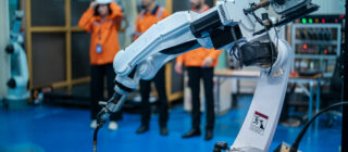 robotics engineers working on robot arm