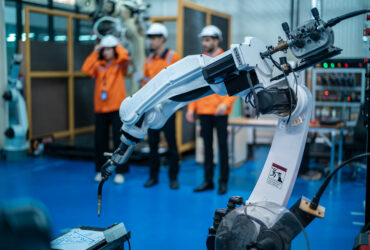 robotics engineers working on robot arm