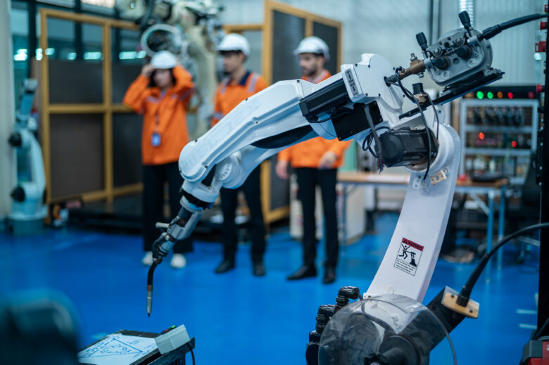robotics engineers working on robot arm