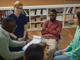 therapy session with young college students sitting in circle