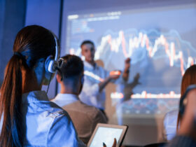 people gathered around stock charts