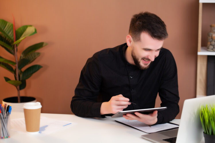 businessman working at office on tablet