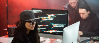 young woman hacking a computer